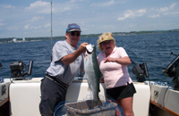 wayne helps hold this beautifull steelhead for sister Deb